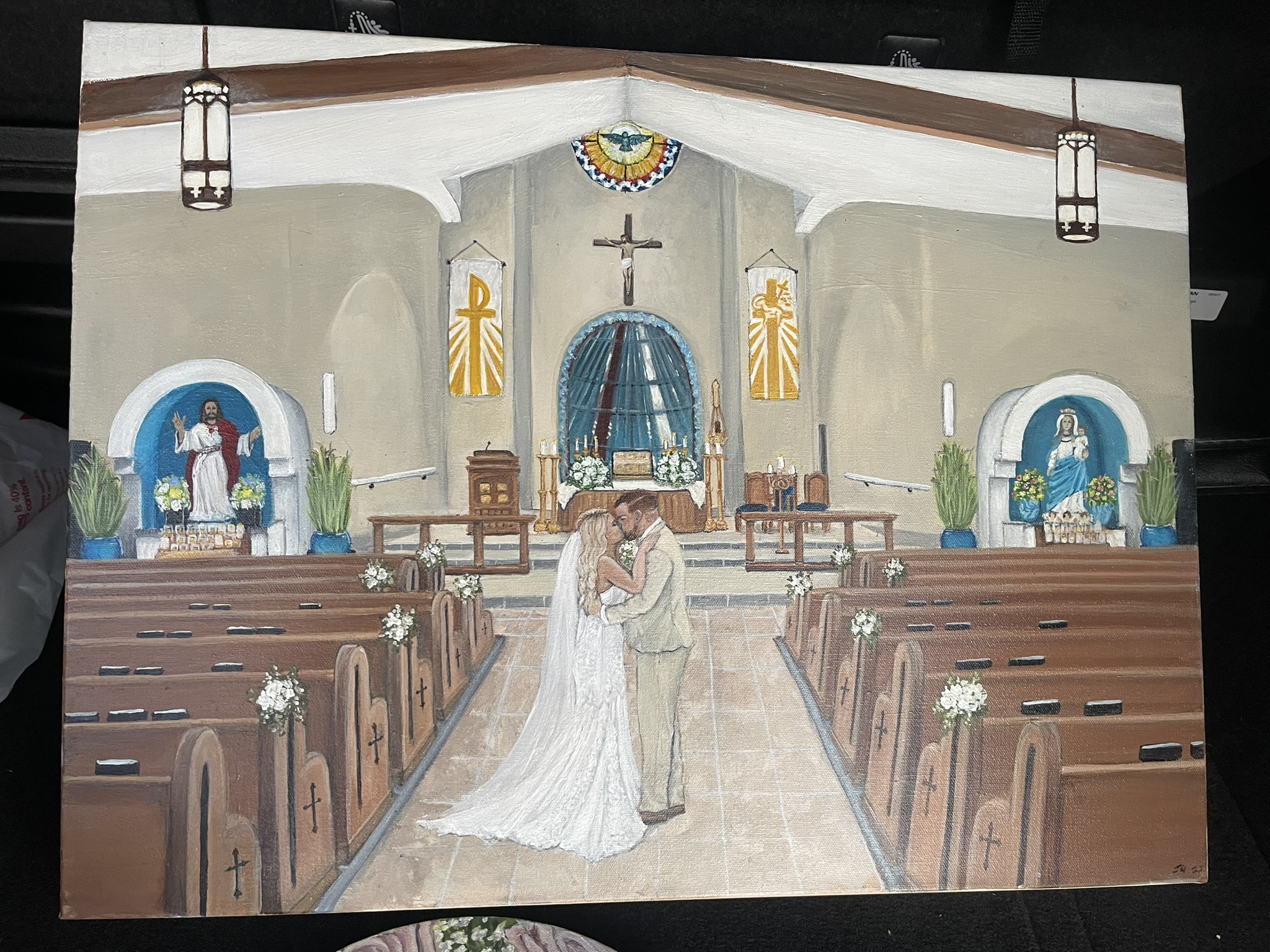 Live painting of a couple at the altar inside a church
