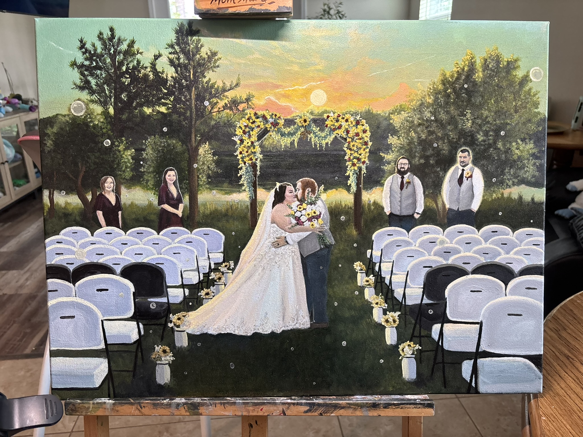 Live painting of a sunflower arch ceremony at sunset with bridal party