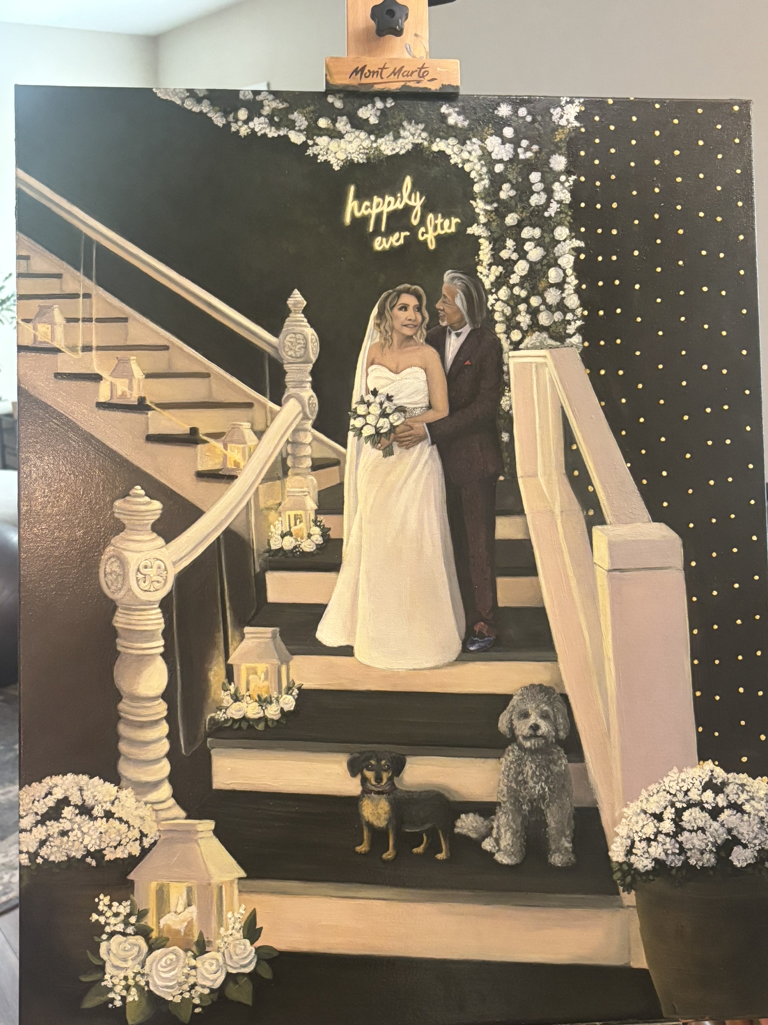 Live painting of a couple and their dogs on a staircase reading Happily Ever After