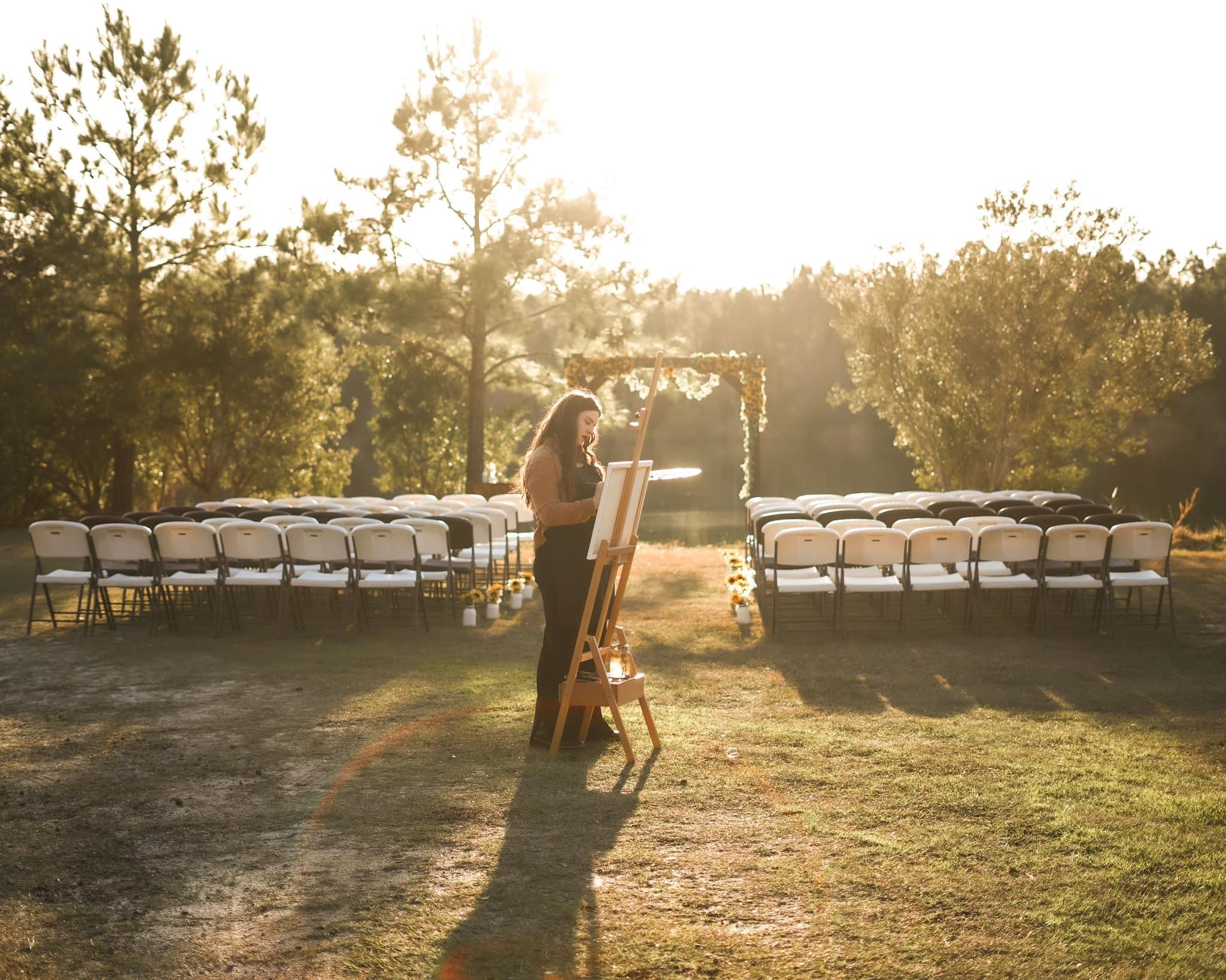 Savannah painting live at a wedding ceremony at golden hour